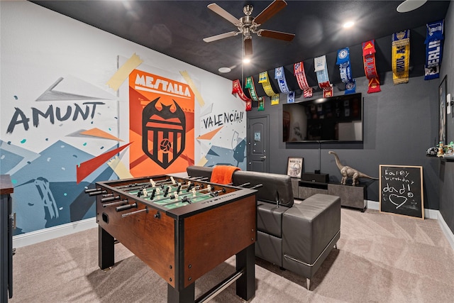 recreation room featuring ceiling fan, baseboards, and carpet