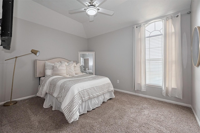 bedroom with baseboards, multiple windows, and carpet