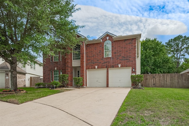 view of front of property featuring fence, concrete driveway, and a front lawn