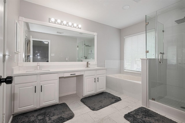 full bathroom featuring a sink and a stall shower