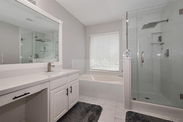 bathroom with vanity, visible vents, a garden tub, and a stall shower