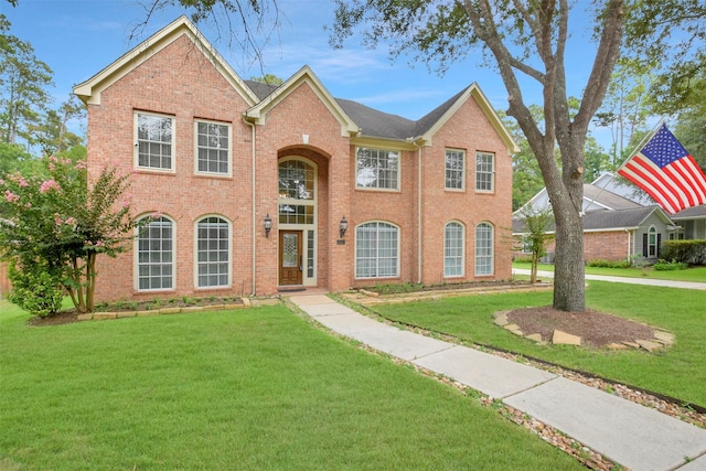 14010 Lakewood Crossing Blvd, Houston, TX 77070 - traditional-style house featuring a front yard and brick siding