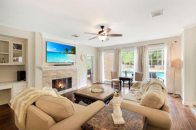14010 Lakewood Crossing Blvd, Houston, TX 77070 - living area with visible vents, a glass covered fireplace, and wood finished floors