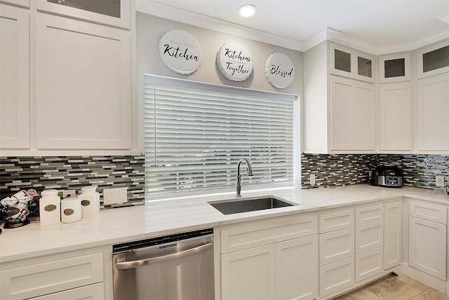 14010 Lakewood Crossing Blvd, Houston, TX 77070 - kitchen featuring tasteful backsplash, stainless steel dishwasher, a sink, white cabinets, and ornamental molding