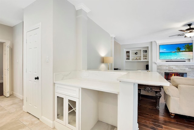 14010 Lakewood Crossing Blvd, Houston, TX 77070 - bar featuring baseboards, a ceiling fan, built in features, and a glass covered fireplace