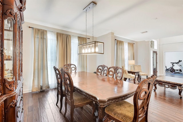 14010 Lakewood Crossing Blvd, Houston, TX 77070 - dining room with crown molding, baseboards, visible vents, and dark wood-type flooring