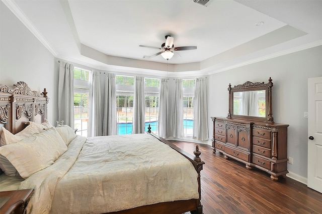 14010 Lakewood Crossing Blvd, Houston, TX 77070 - bedroom with access to exterior, crown molding, dark wood finished floors, a raised ceiling, and baseboards