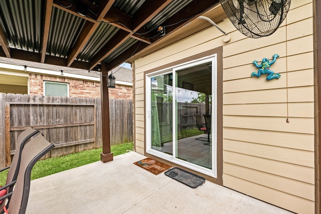 view of patio / terrace featuring fence
