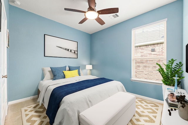 bedroom featuring carpet floors, baseboards, and multiple windows