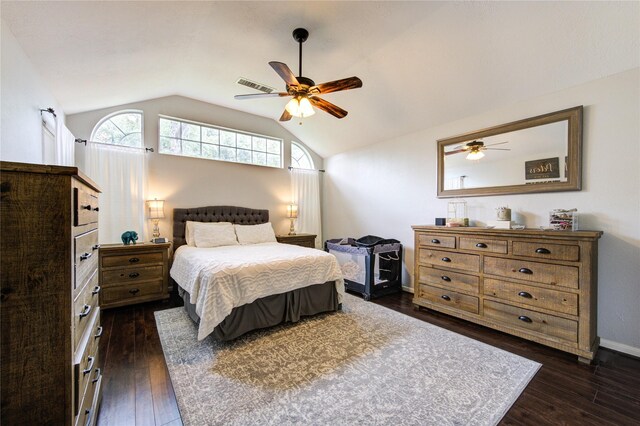 bedroom featuring visible vents, dark wood finished floors, ceiling fan, and vaulted ceiling