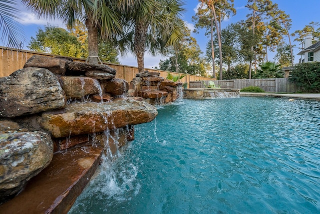 view of swimming pool featuring a fenced in pool and a fenced backyard