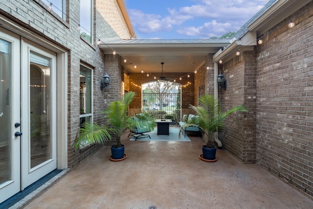 view of patio / terrace featuring french doors and ceiling fan