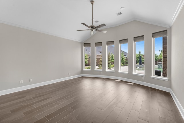 empty room featuring visible vents, lofted ceiling, baseboards, dark wood-type flooring, and a ceiling fan