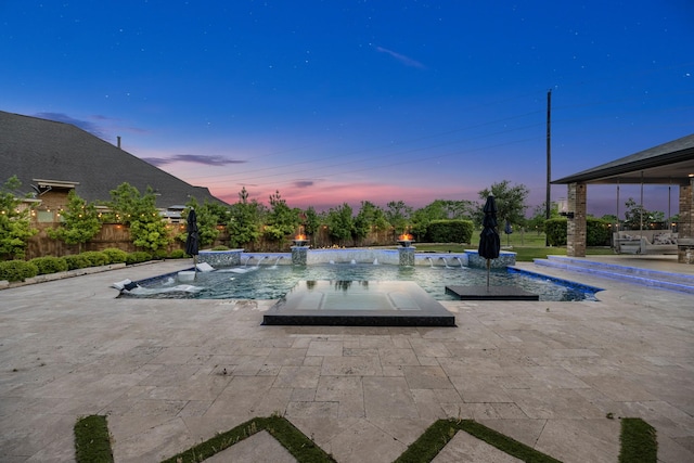 view of swimming pool with a patio, a hot tub, fence, and a fenced in pool