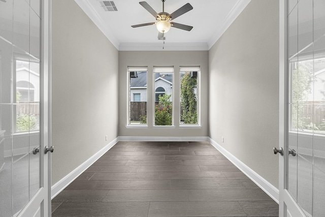 unfurnished room featuring visible vents, crown molding, a healthy amount of sunlight, and french doors
