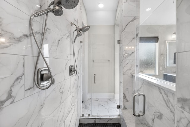bathroom with a marble finish shower and marble finish floor