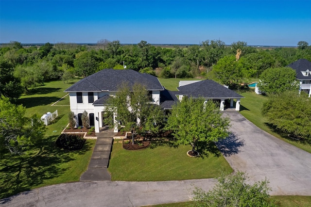 7576 River Ridge Drive, College Station, TX 77845 - view of front of property with aphalt driveway, stucco siding, and a front yard