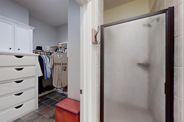 7576 River Ridge Drive, College Station, TX 77845 - full bathroom with a spacious closet and a stall shower