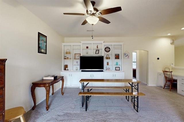 7576 River Ridge Drive, College Station, TX 77845 - living room with ceiling fan, light carpet, arched walkways, baseboards, and visible vents