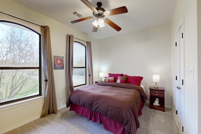 7576 River Ridge Drive, College Station, TX 77845 - carpeted bedroom with visible vents, a ceiling fan, and baseboards