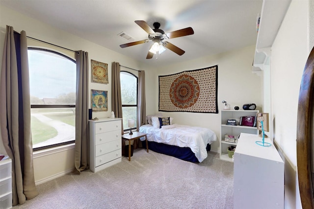 7576 River Ridge Drive, College Station, TX 77845 - bedroom featuring visible vents, a ceiling fan, baseboards, and light colored carpet