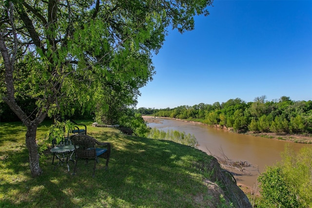 7576 River Ridge Drive, College Station, TX 77845 - view of yard with a view of trees and a water view