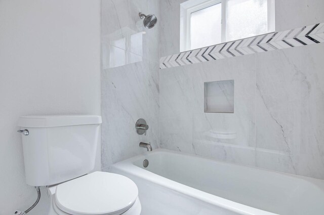 full bathroom featuring shower / bathtub combination and toilet