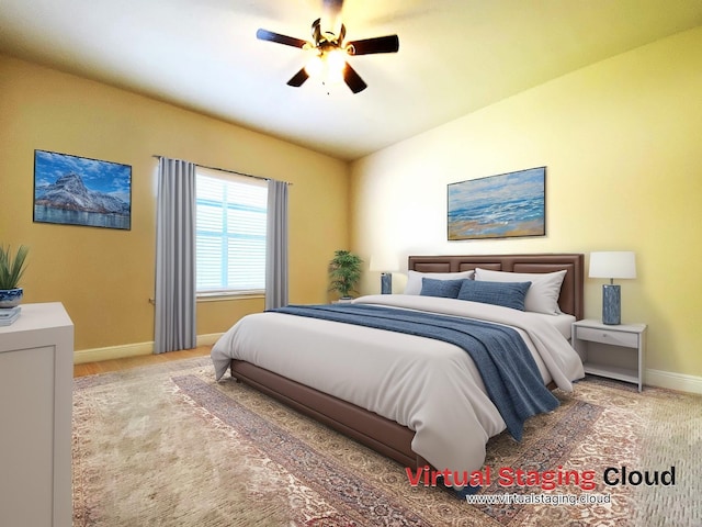 bedroom with ceiling fan and baseboards