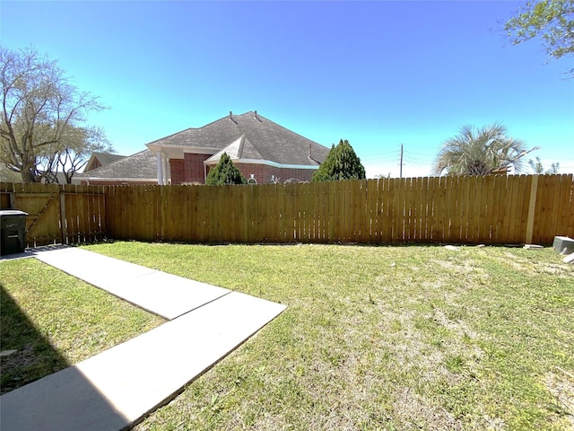 view of yard featuring a fenced backyard