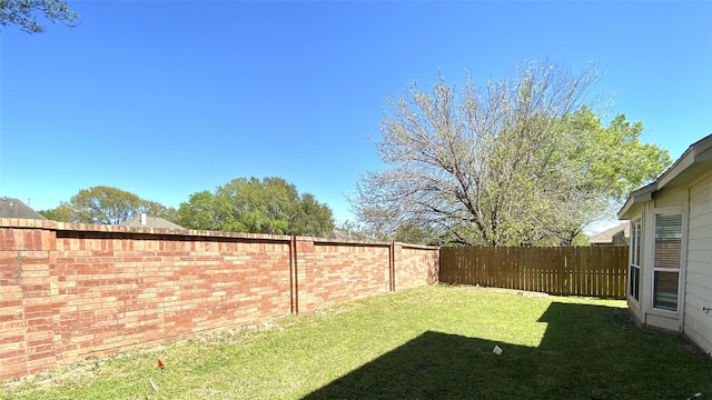 view of yard featuring a fenced backyard
