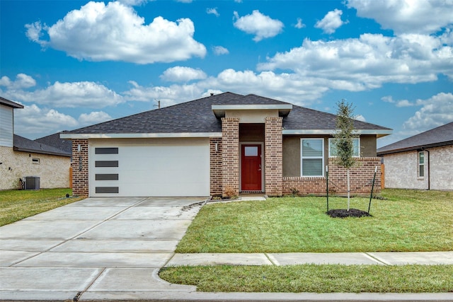 3907 Itzle Island Ct, Katy, TX 77494 - view of front of home with driveway, roof with shingles, brick siding, central AC, and an attached garage