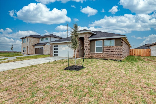 3907 Itzle Island Ct, Katy, TX 77494 - prairie-style house featuring a garage, a front lawn, fence, brick siding, and driveway