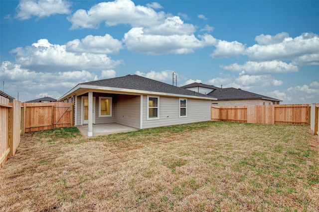 3907 Itzle Island Ct, Katy, TX 77494 - back of house with a patio, a fenced backyard, and a lawn