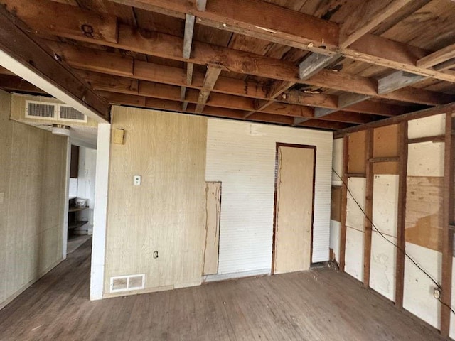 miscellaneous room featuring visible vents and wood finished floors