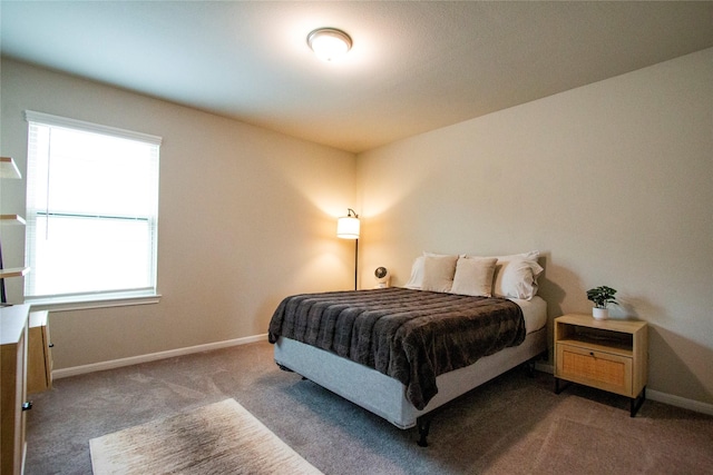 carpeted bedroom with baseboards