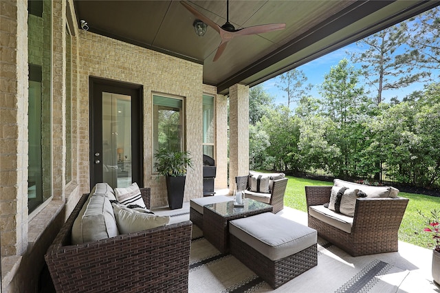 view of patio with ceiling fan and an outdoor living space