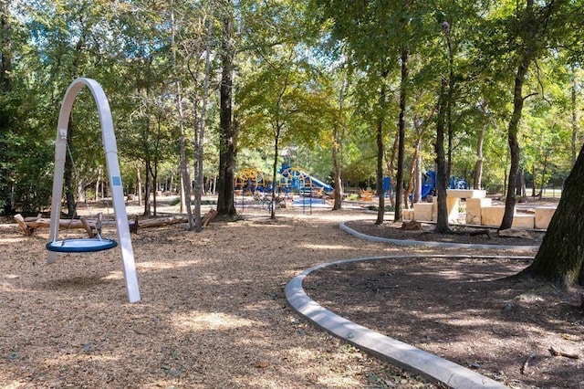 view of home's community featuring playground community