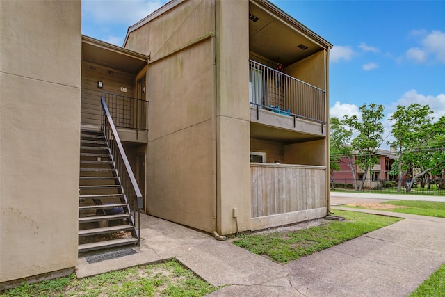 view of building exterior with stairway