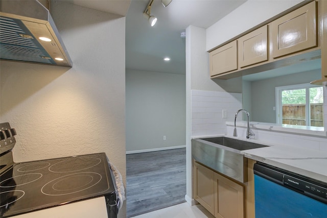 kitchen with electric range, light stone countertops, dishwasher, a sink, and under cabinet range hood