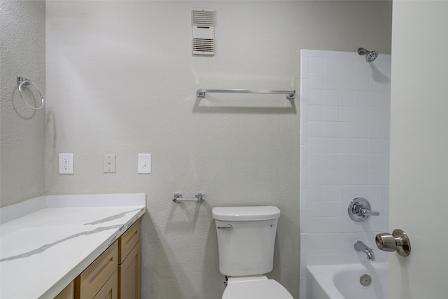 bathroom featuring vanity, visible vents, toilet, and shower / washtub combination