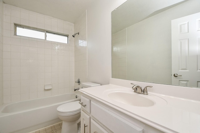 bathroom featuring toilet, tile patterned flooring, bathing tub / shower combination, and vanity