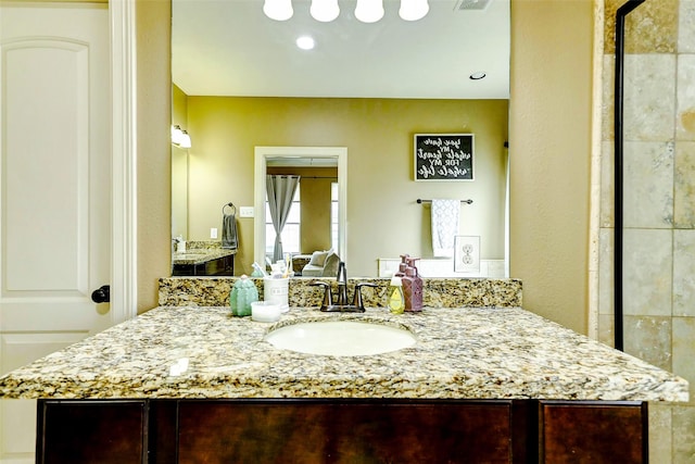 bathroom with vanity and recessed lighting