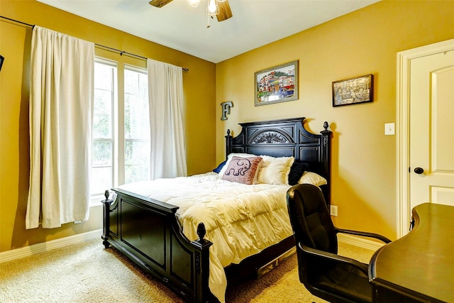 bedroom with baseboards, ceiling fan, and carpet flooring