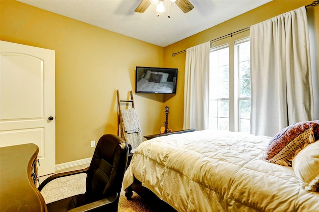 bedroom with baseboards and ceiling fan
