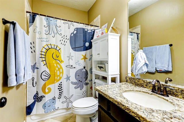 bathroom with vanity, a shower with shower curtain, tile patterned flooring, and toilet