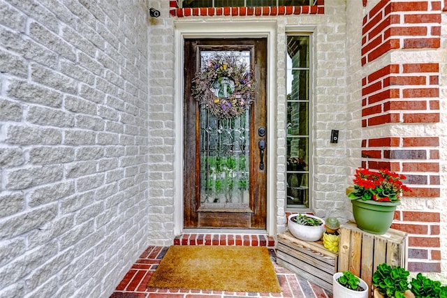 property entrance with brick siding