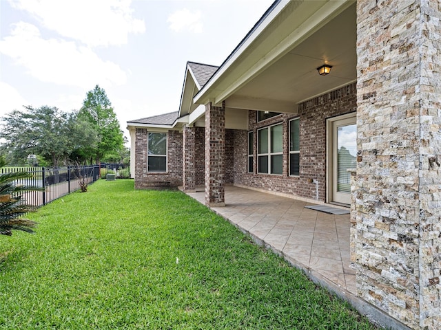 view of yard featuring a patio and fence
