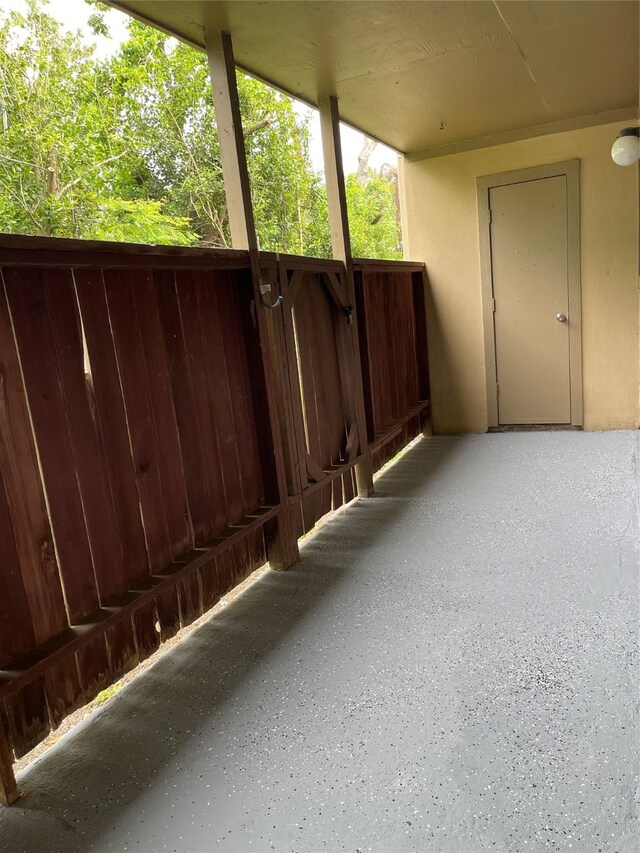 view of patio featuring fence