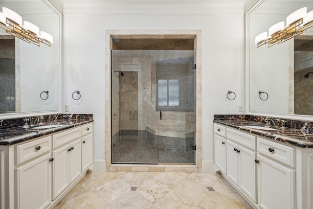 bathroom with a sink, a stall shower, and ornamental molding