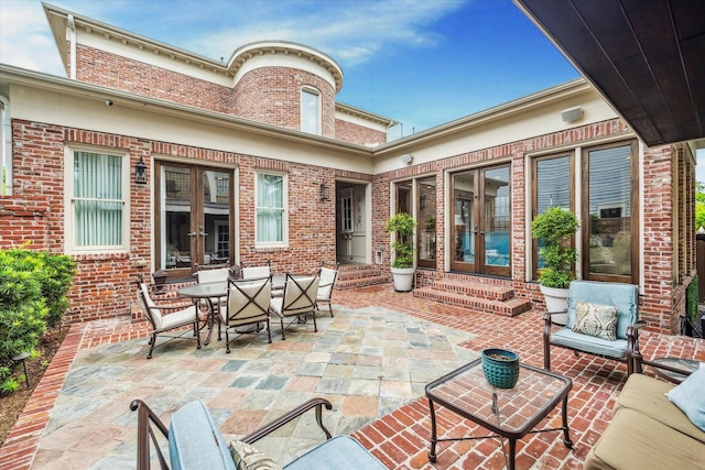 view of patio / terrace featuring an outdoor living space, french doors, and entry steps